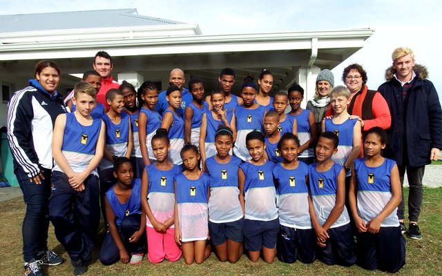 A group picture during the hand-over to the Foundation’s Athletics children, with Adéle Geldenhuys, Taurus General Manager 2nd from the right.  